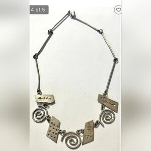 Mexican Sterling silver necklace with‎ cutout designs stamped 925, 17" long